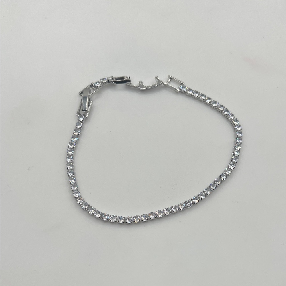 1186. White Gold & Crystal Tennis Bracelet. 6 1/2” - 7 1/2”